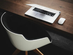 The hand rail is going a little faster than the moving sidewalk.